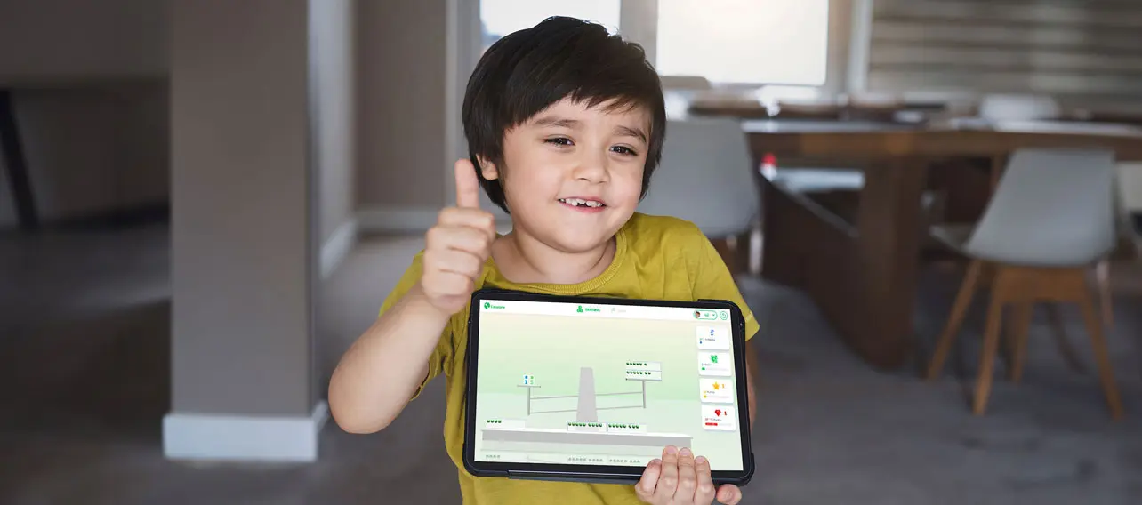 Kid holding tablet with open Calcularis app