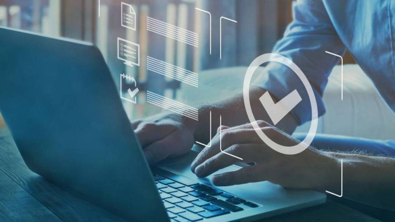 A man using a laptop for his certification process