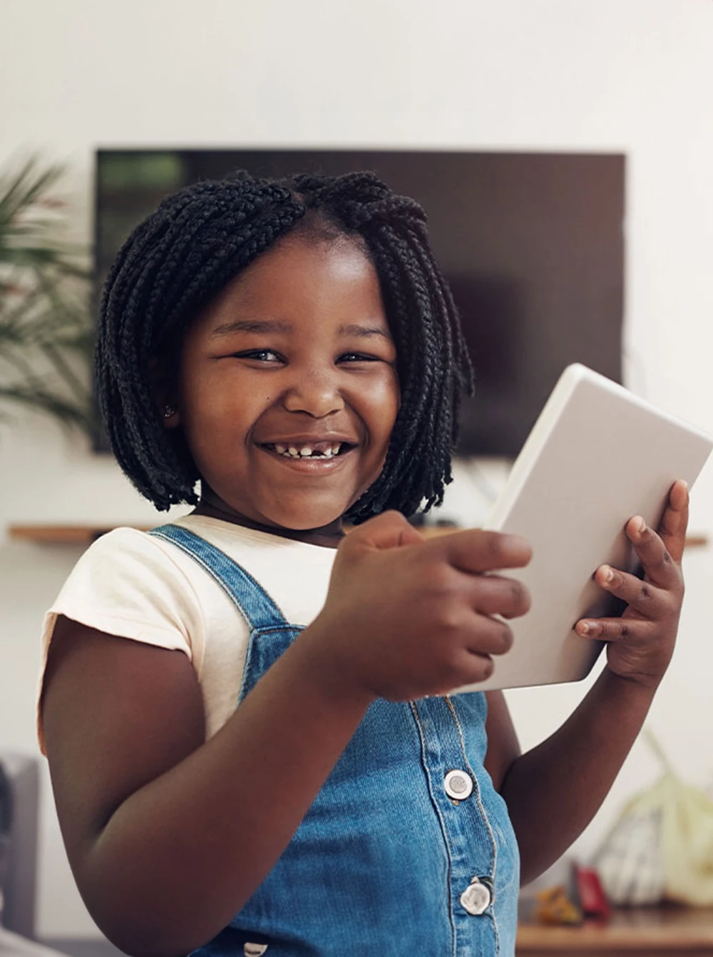 a girl holding a tablet