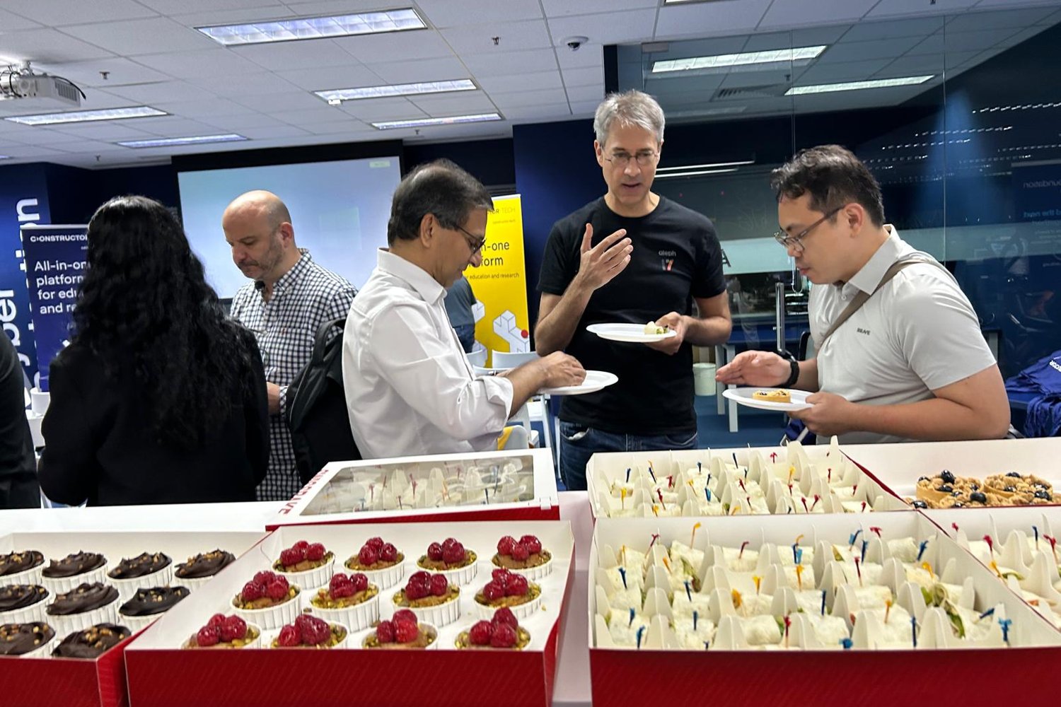 Guests networking over food after the panel