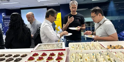 Guests networking over food after the panel