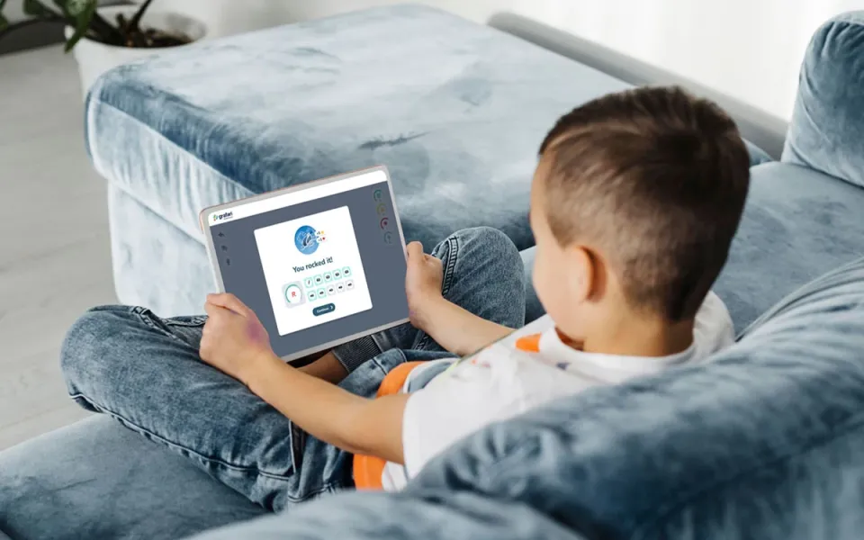 a boy learning with Grafari using a tablet