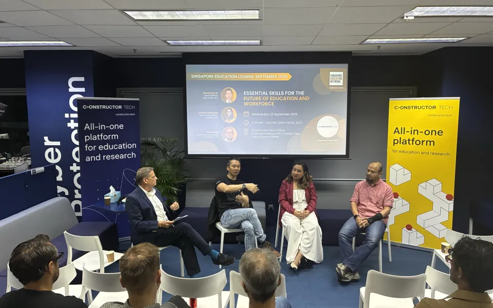 Alex Boome moderating the panel at the Singapore Education Lounge