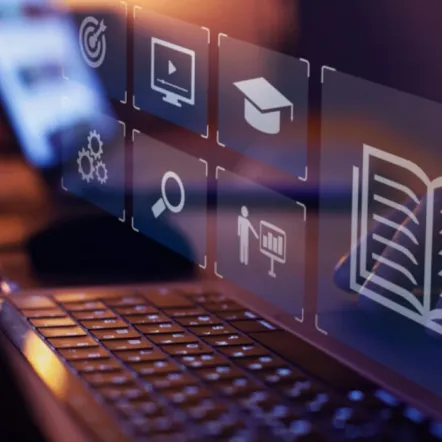 digital education icons over laptop keyboard